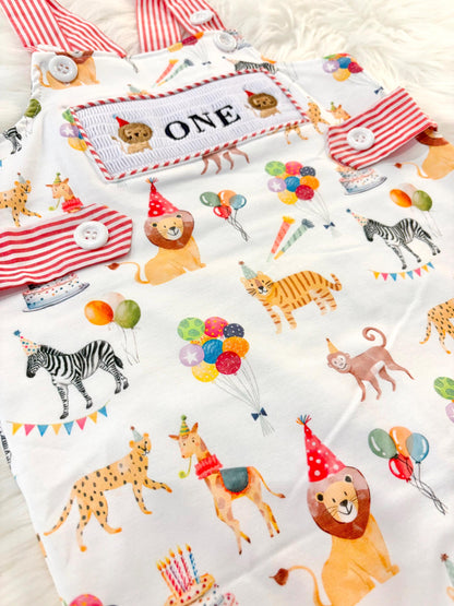 carnival circus party animal cake smash outfit first birthday boy romper 1st birthday red  and white striped stripes colorful smash cake outfit overalls, ONE smocked romper first birthday, animals lion embroidered smocked spring summer 1st birthday boy outfit romper baby boys cake smash outfit, the mod mango baby boutique co