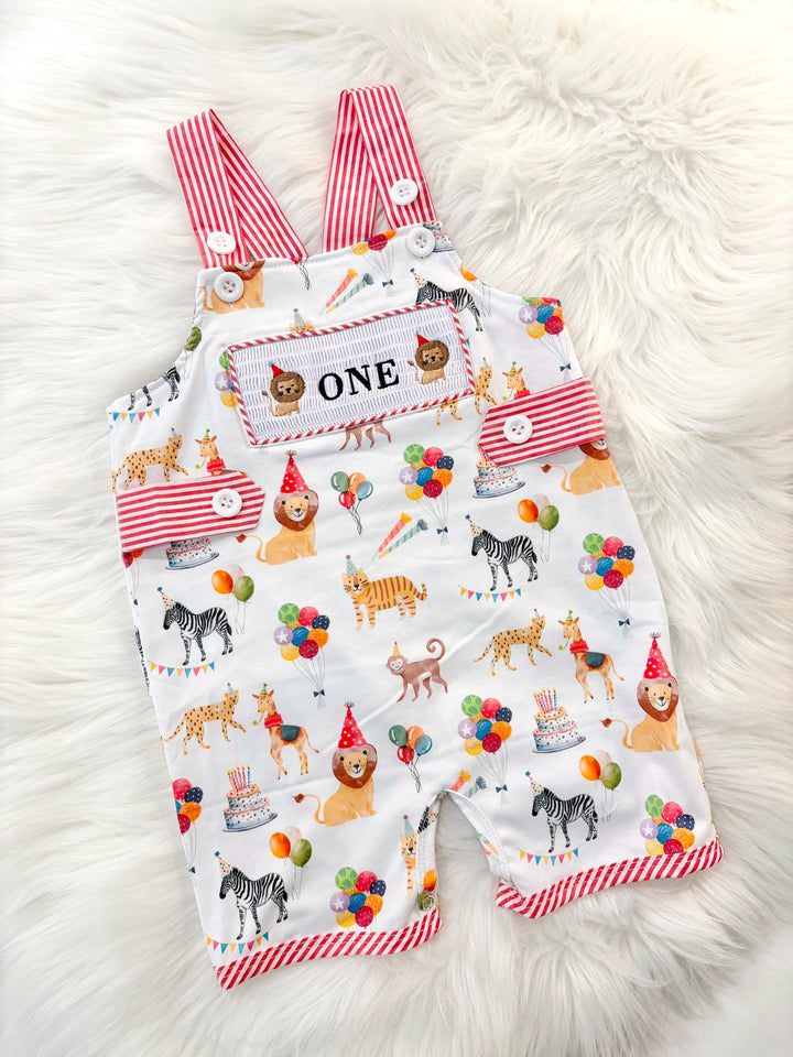 carnival circus party animal cake smash outfit first birthday boy romper 1st birthday red  and white striped stripes colorful smash cake outfit overalls, ONE smocked romper first birthday, animals lion embroidered smocked spring summer 1st birthday boy outfit romper baby boys cake smash outfit, the mod mango baby boutique co