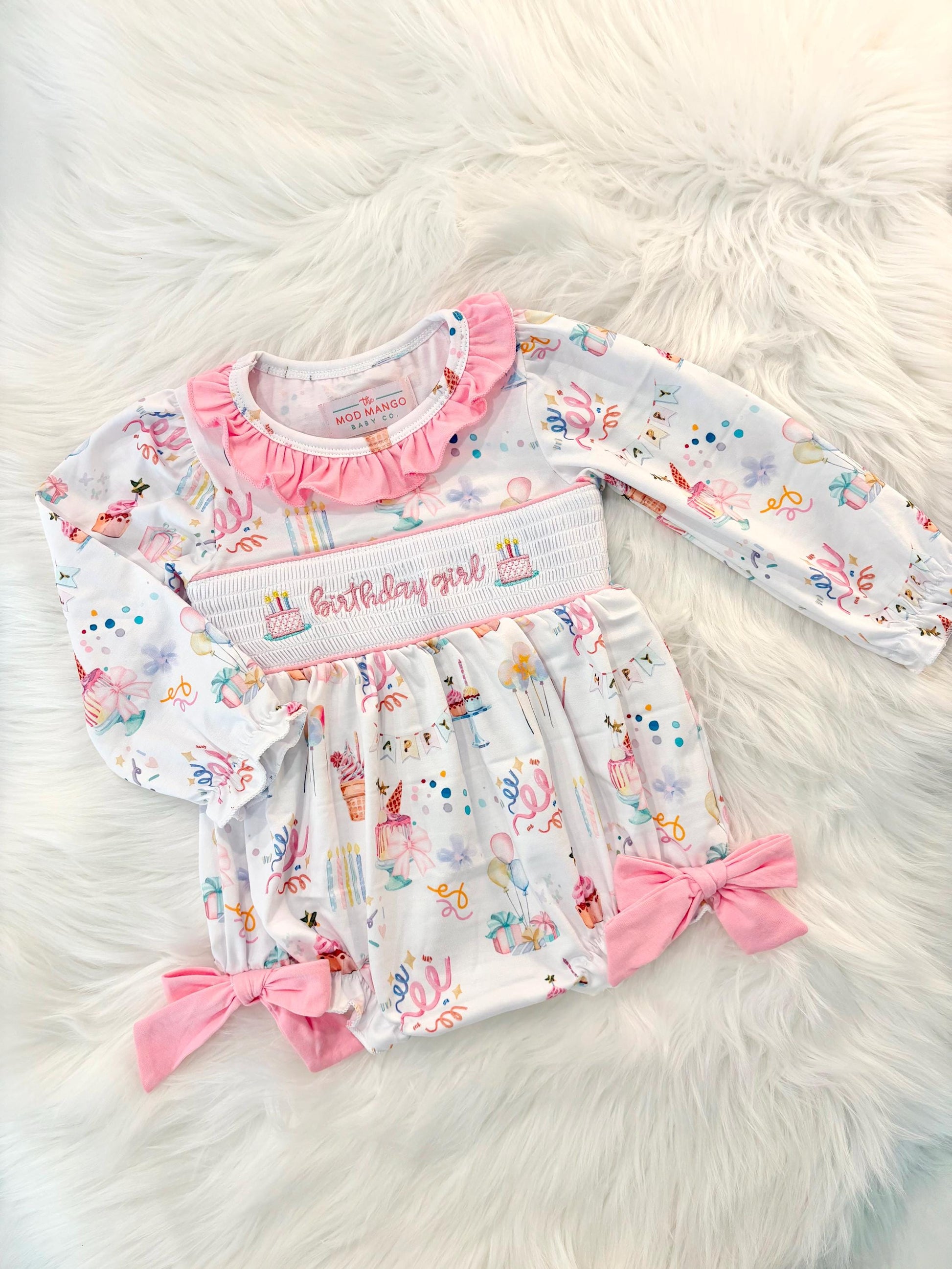 one is fun first birthday outfit, pink first birthday smocked bubble romper outfit its fun to be one pink bow ruffle first birthday girl romper pink and white outfit, colorful rainbow pink white smocked bubble romper first birthday winter bows ruffle bows  embroidered smocked long sleeve 1st birthday outfit romper baby girls, the mod mango baby boutique co