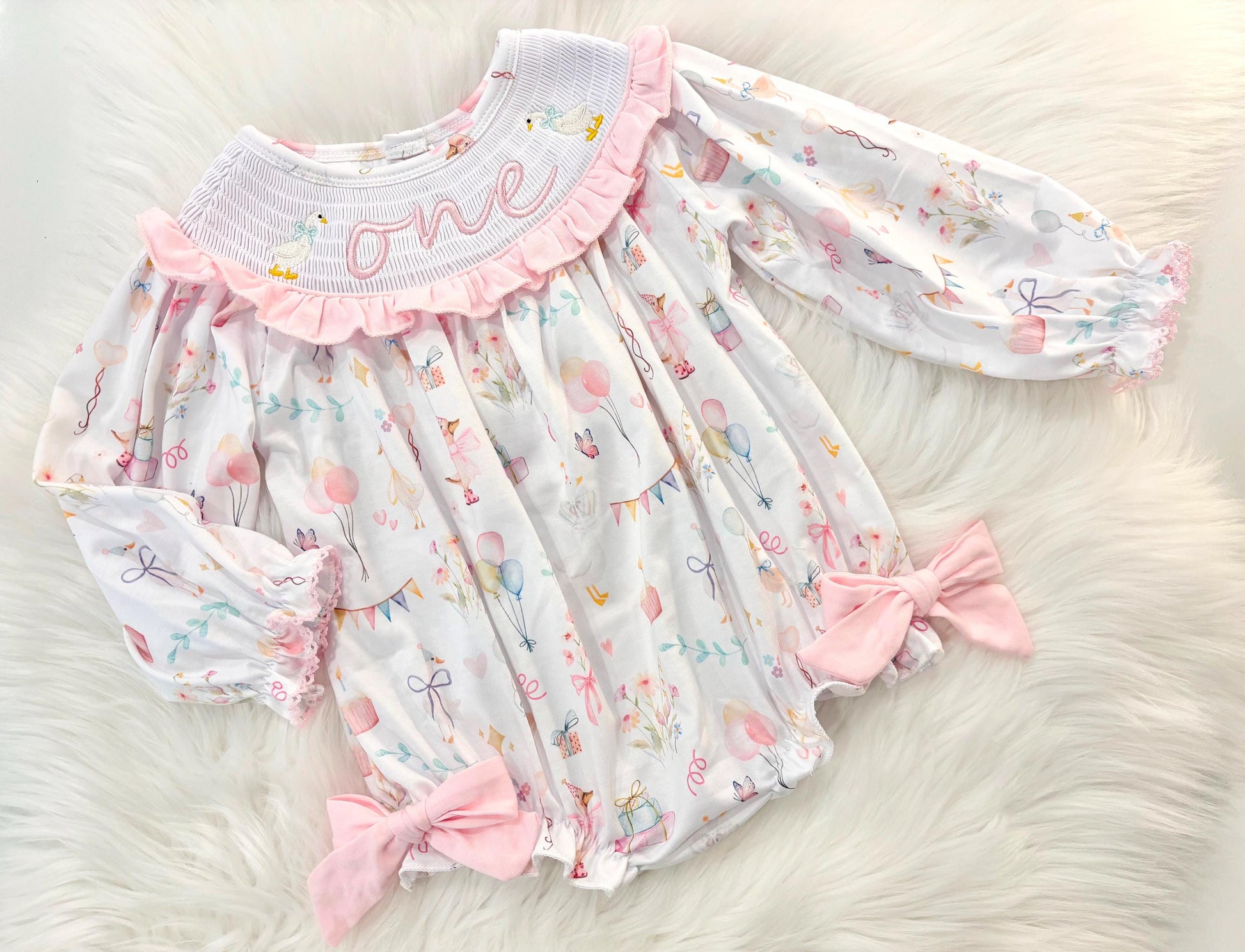 one silly goose girls first birthday bubble romper outfit pink bows first birthday girl romper pink and white outfit, pink sage green smocked dress first birthday embroidered  goose smocked short sleeve 1st birthday outfit ruffle dress baby girls