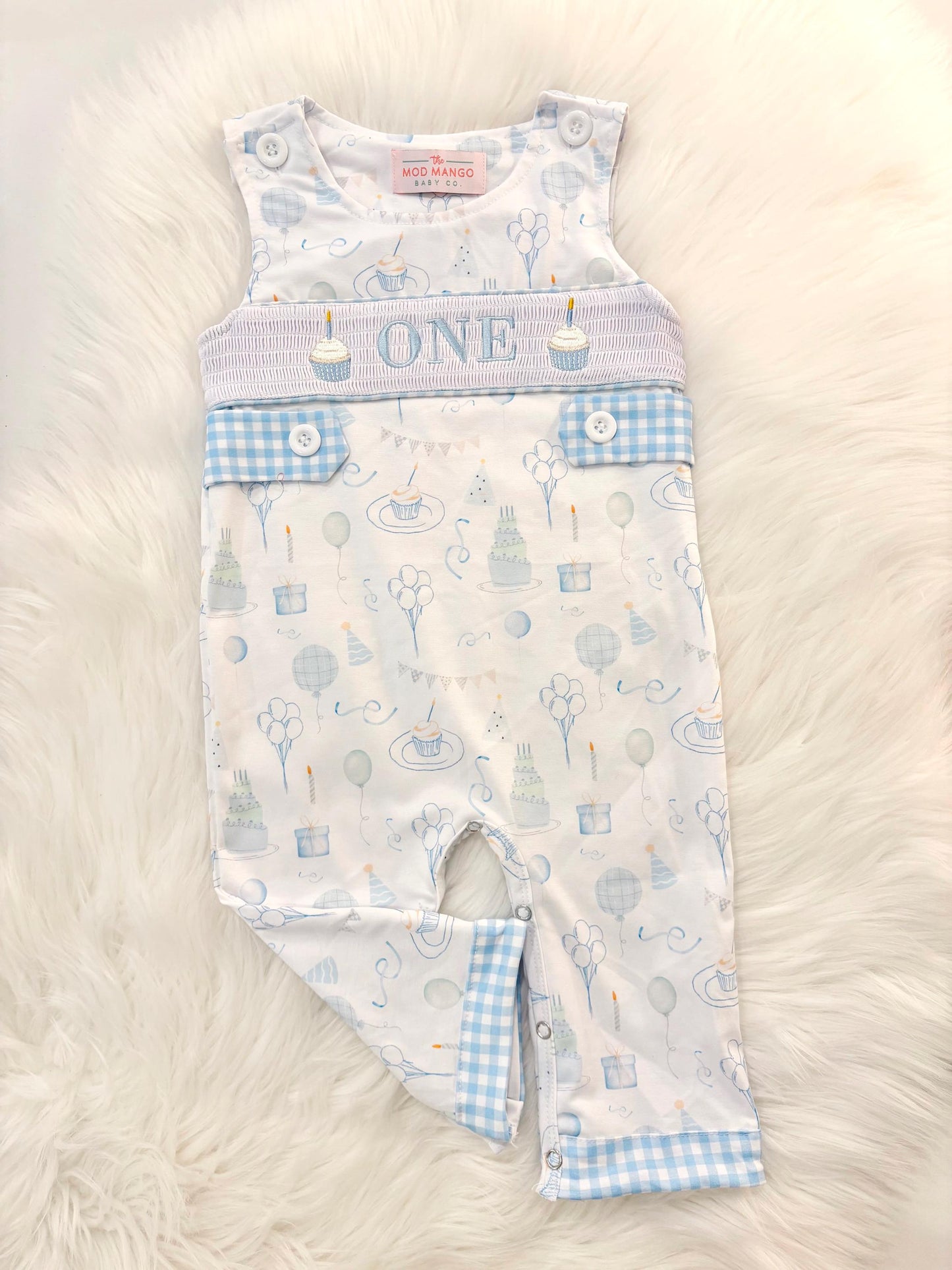 blue and white gingham checkered first birthday cupcakes romper pants outfit, one is fun first birthday outfit, it&#39;s fun to be one first birthday boy romper blue green longtalls blue white gingham smash cake outfit overalls, ONE smocked romper first birthday party hats, balloons embroidered smocked spring summer fall 1st birthday boy outfit romper baby boys 1st birthday cake smash outfit, the mod mango baby boutique co, boys first birthday outfit theme