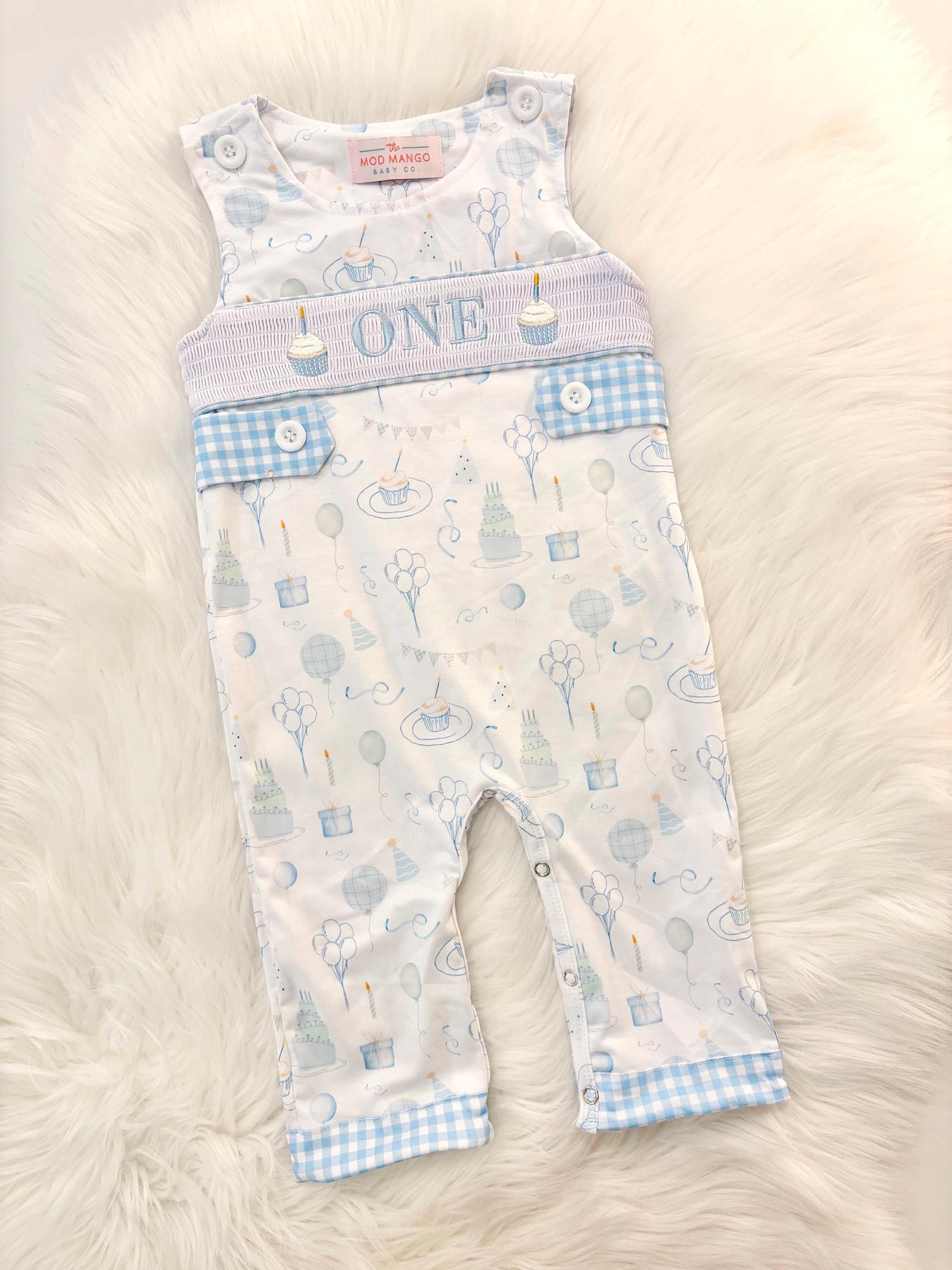 blue and white gingham checkered first birthday cupcakes romper pants outfit, one is fun first birthday outfit, it's fun to be one first birthday boy romper blue green longtalls blue white gingham smash cake outfit overalls, ONE smocked romper first birthday party hats, balloons embroidered smocked spring summer fall 1st birthday boy outfit romper baby boys 1st birthday cake smash outfit, the mod mango baby boutique co, boys first birthday outfit theme