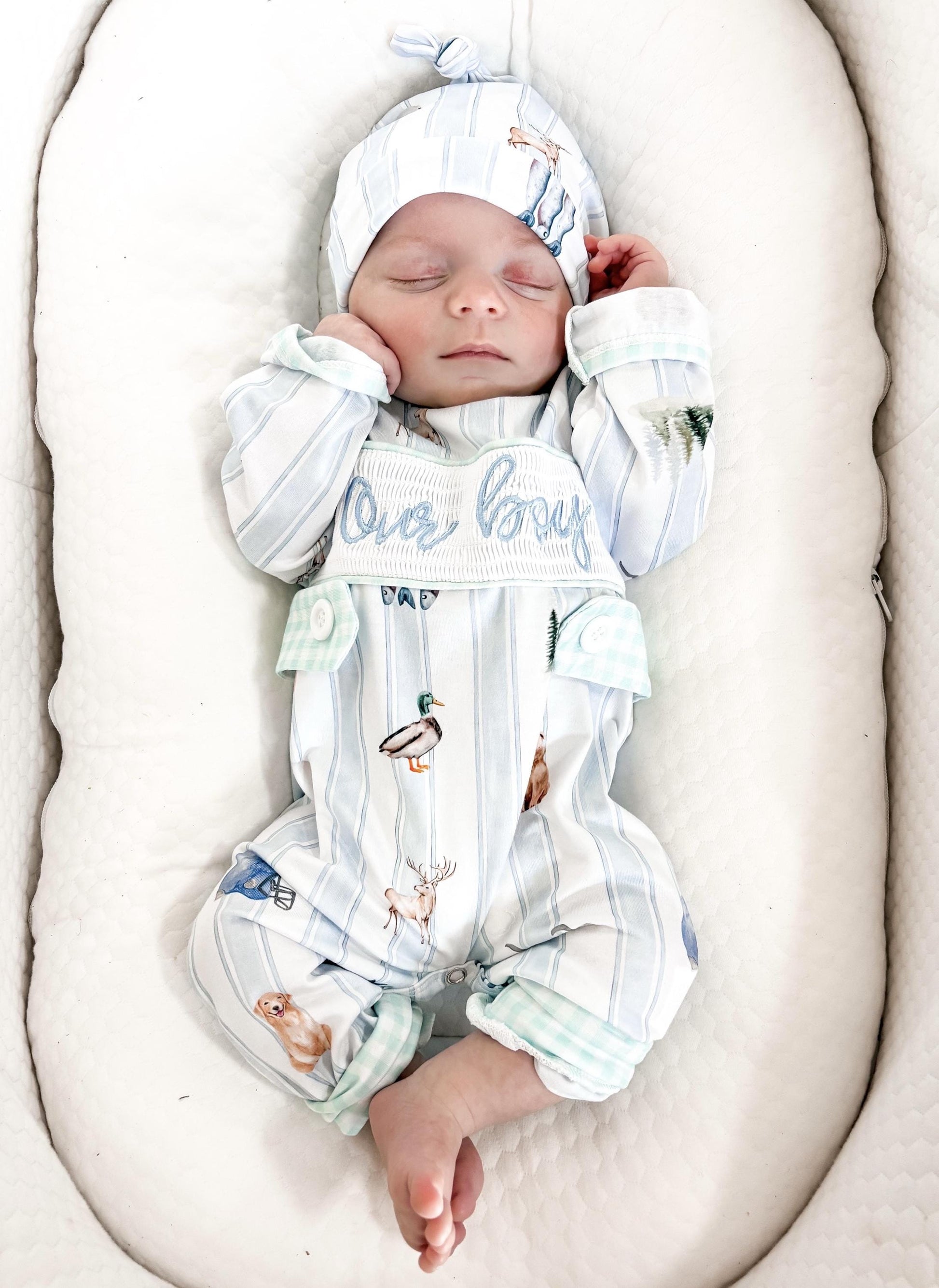 preppy newborn boys baby blue and white smocked baby romper outfit bodysuit and knotted hat with stripes and boy hunting for baby, fish buck deer bear football sports baseball mallard duck puppy dog pine trees outdoor all american boy, our boy monogram baby shower gift for boy, light blue and mint green gingham baby gift, newborn coming home outfit, baby shower gift set, pregnancy announcement, custom newborn baby romper outfit, boutique smocked baby gift set, the mod mango baby boutique co