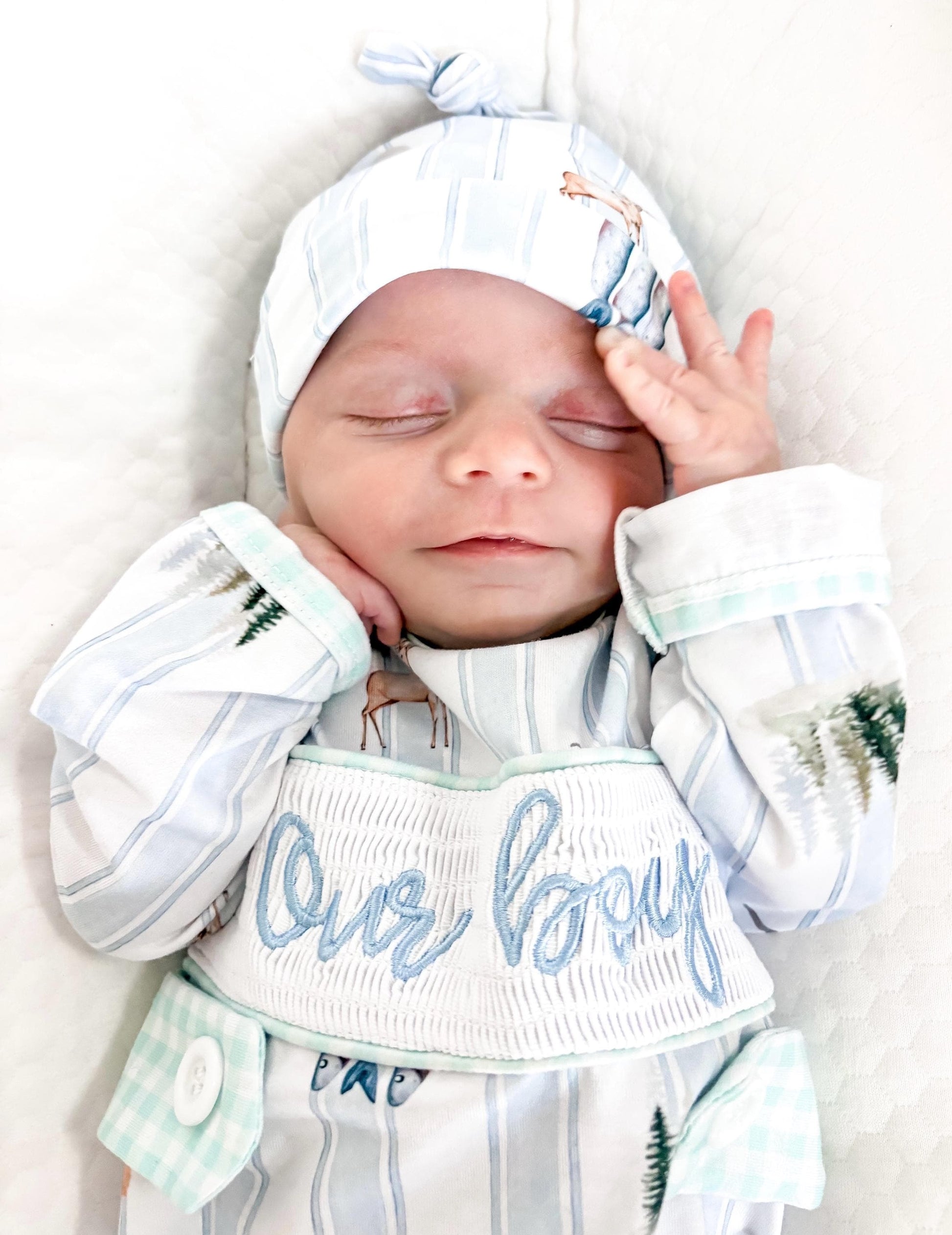 preppy newborn boys baby blue and white smocked baby romper outfit bodysuit and knotted hat with stripes and boy hunting for baby, fish buck deer bear football sports baseball mallard duck puppy dog pine trees outdoor all american boy, our boy monogram baby shower gift for boy, light blue and mint green gingham baby gift, newborn coming home outfit, baby shower gift set, pregnancy announcement, custom newborn baby romper outfit, boutique smocked baby gift set, the mod mango baby boutique co