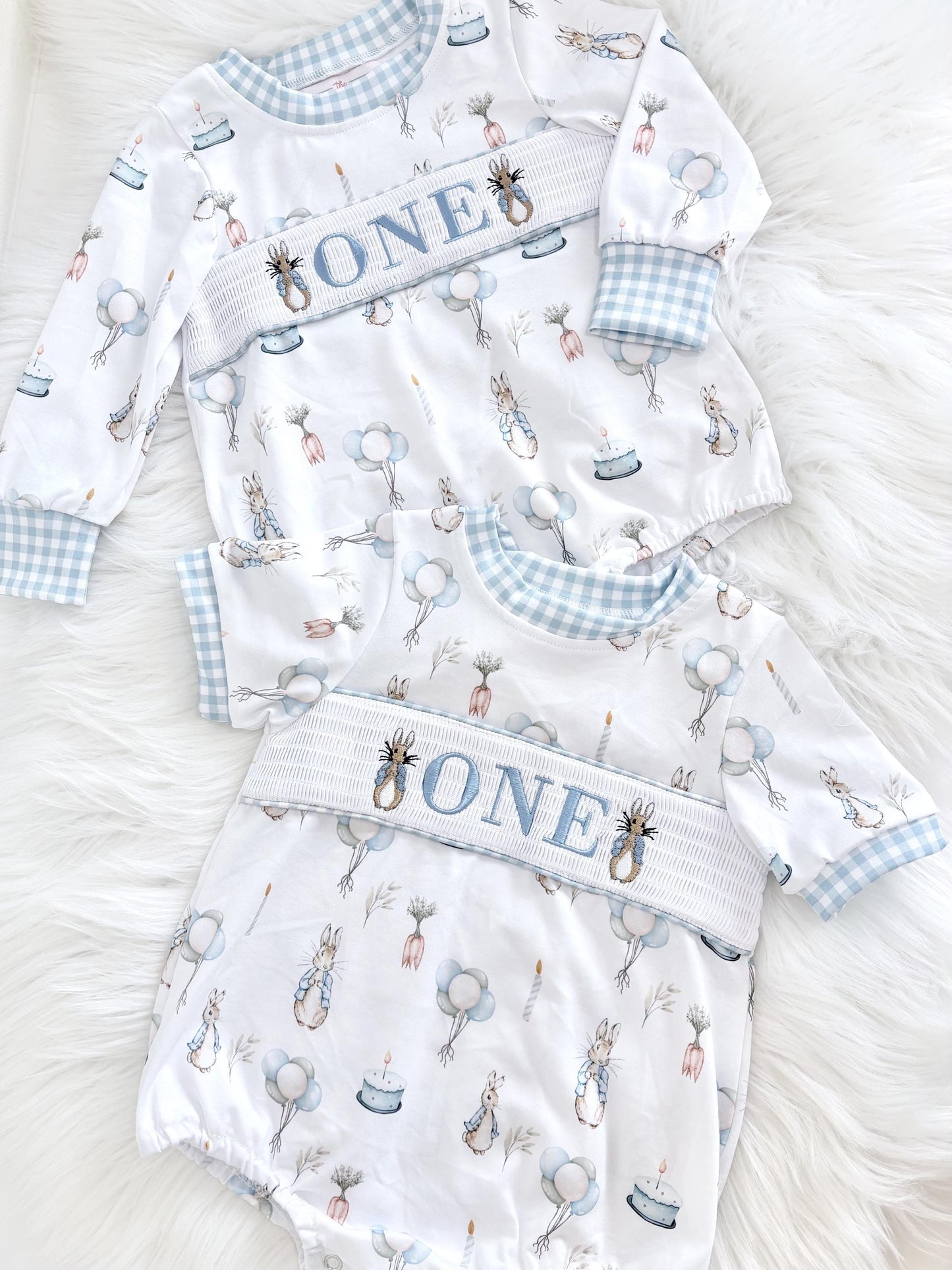 peter rabbit shirt first birthday boy romper spring baby blue and white gingham checkered tan beige outfit, ONE smocked bubble romper first birthday bunny rabbit, some bunny is one embroidered smocked 1st birthday outfit romper baby boys easter, the mod mango baby boutique co