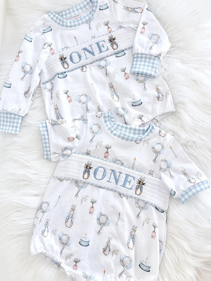 peter rabbit shirt first birthday boy romper spring baby blue and white gingham checkered tan beige outfit, ONE smocked bubble romper first birthday bunny rabbit, some bunny is one embroidered smocked 1st birthday outfit romper baby boys easter, the mod mango baby boutique co