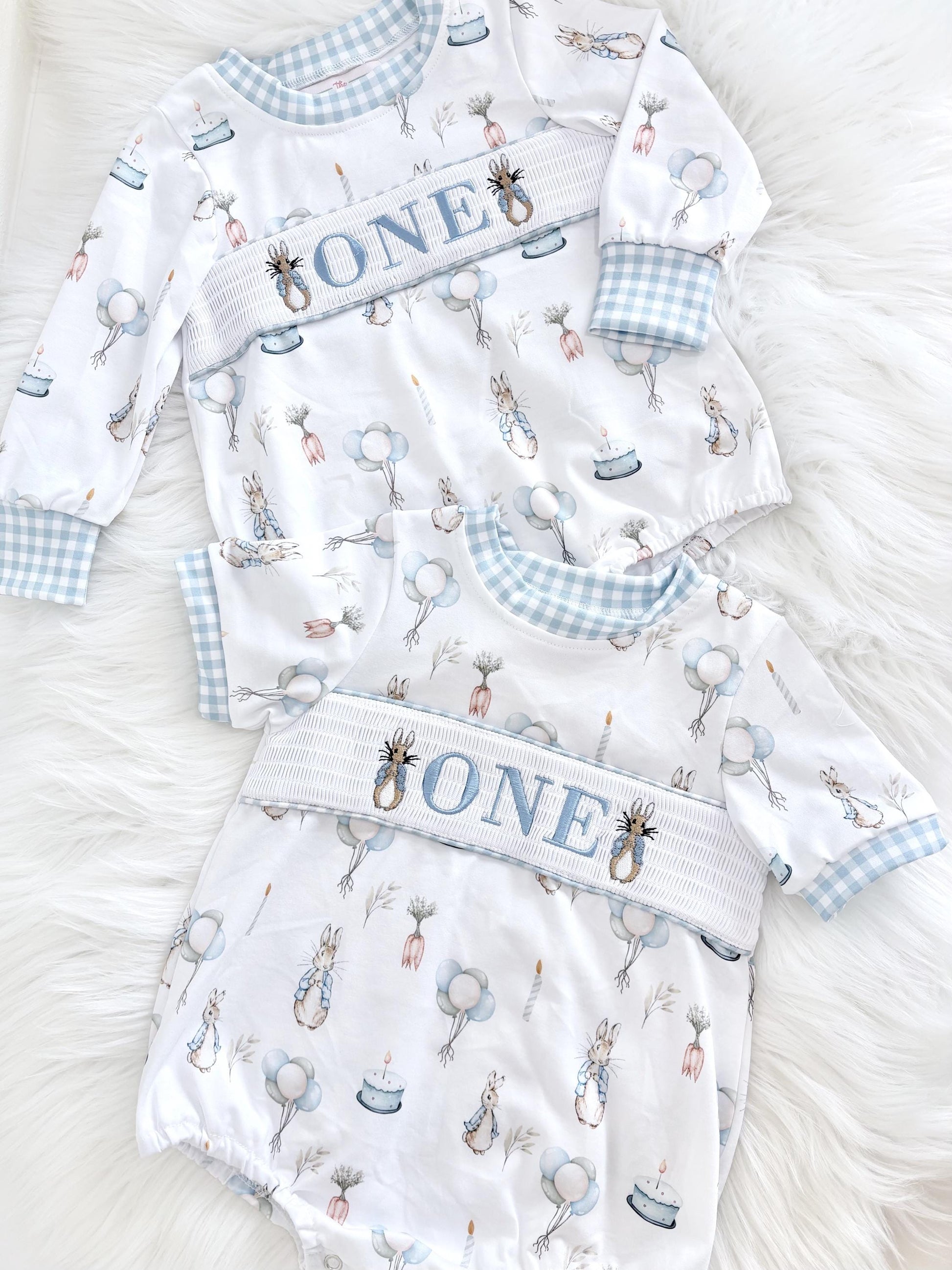 peter rabbit shirt first birthday boy romper spring baby blue and white gingham checkered tan beige outfit, ONE smocked bubble romper first birthday bunny rabbit, some bunny is one embroidered smocked 1st birthday outfit romper baby boys easter, the mod mango baby boutique co