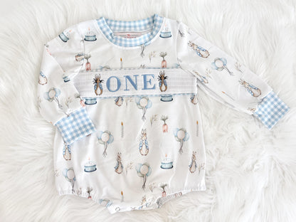 peter rabbit shirt first birthday boy romper spring baby blue and white gingham checkered tan beige outfit, ONE smocked bubble romper first birthday bunny rabbit, some bunny is one embroidered smocked 1st birthday outfit romper baby boys easter, the mod mango baby boutique co