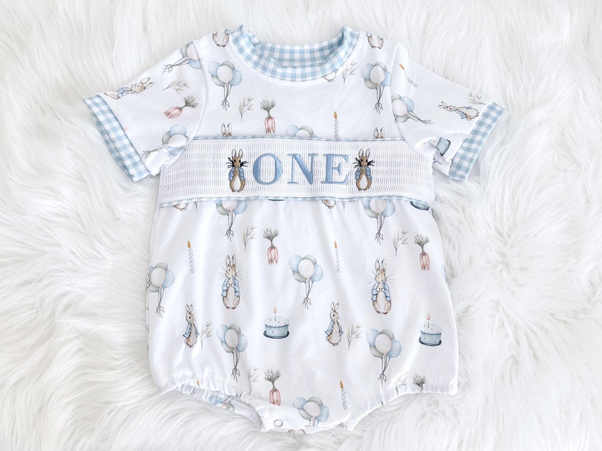 peter rabbit shirt first birthday boy romper spring baby blue and white gingham checkered tan beige outfit, ONE smocked bubble romper first birthday bunny rabbit, some bunny is one embroidered smocked 1st birthday outfit romper baby boys easter, the mod mango baby boutique co