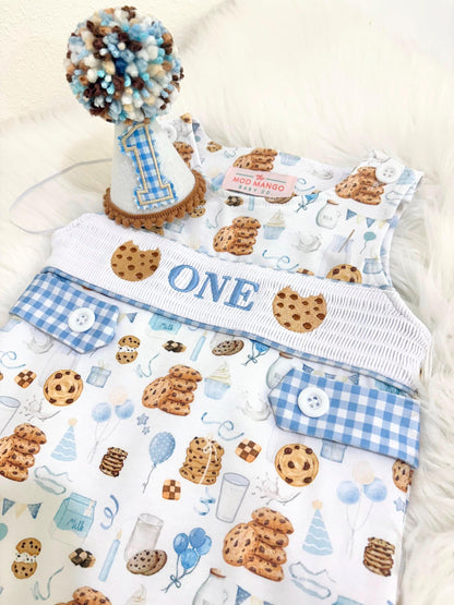 milk and cookies birthday boy romper sweet one cookies shortalls brown tan blue white gingham smash cake outfit overalls, ONE smocked romper first birthday cookies, milk and cookies embroidered smocked spring summer fall 1st birthday boy outfit romper baby boys sweets 1st birthday