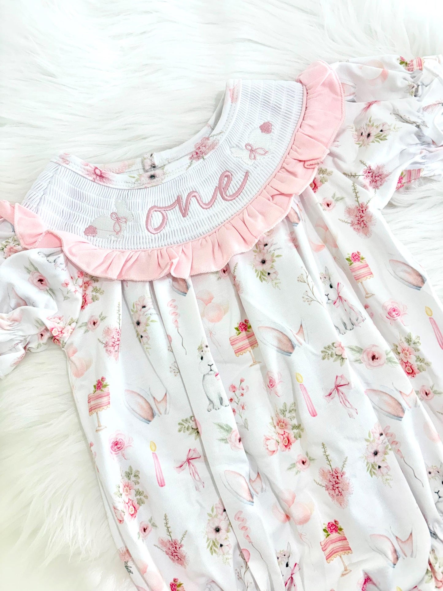 some bunny is one  pink bow first birthday girl romper pink and white outfit, girls one pink white smocked romper dress first birthday spring bunny rabbit easter bow ruffle embroidered smocked short sleeve 1st birthday outfit romper baby girls, the mod mango baby boutique co