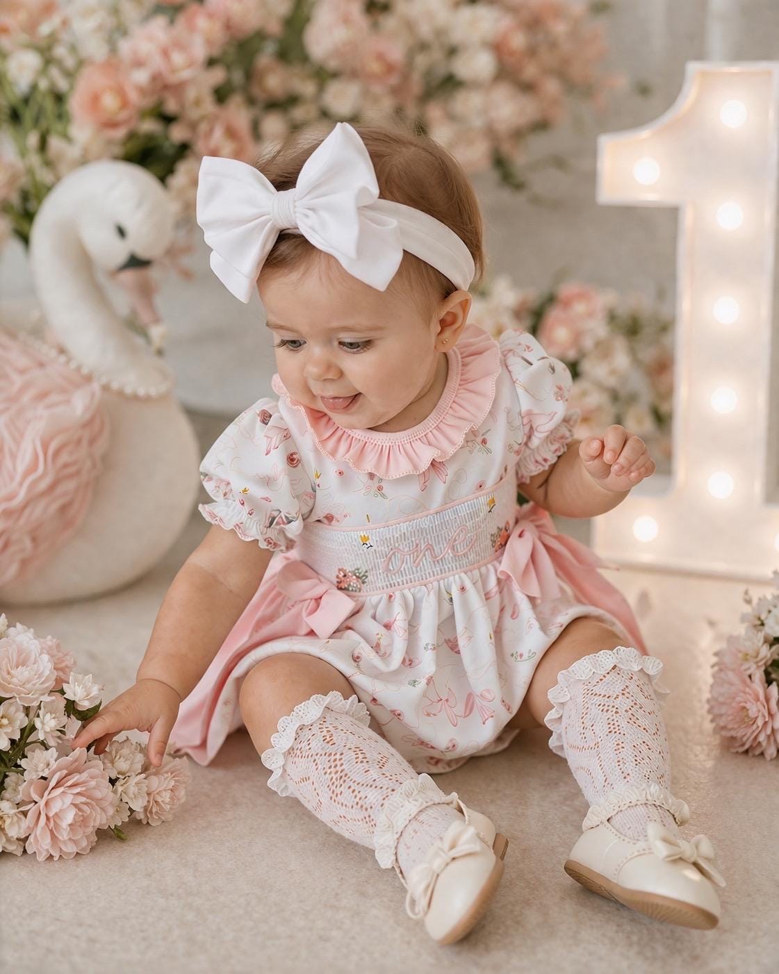 swan princess first birthday outfit bubble romper pink and white floral flowers and bows first birthday girl romper pink and white outfit, girls swans sweet white smocked bubble romper first birthday spring summer bows ruffle embroidered smocked swan 1st birthday outfit romper baby girl cake smash outfit, the mod mango baby boutique co