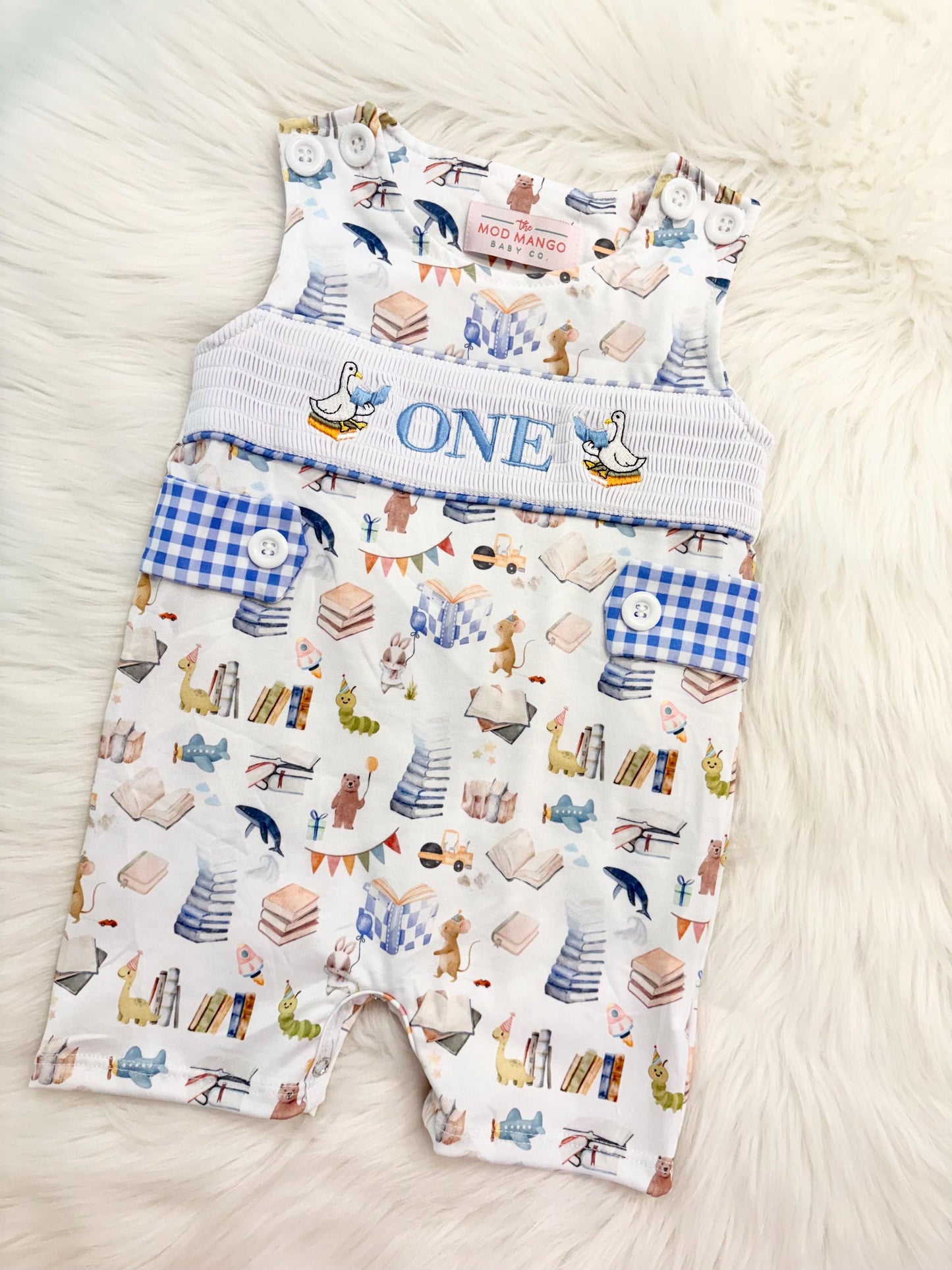 books birthday boy romper one for the books shortalls blue white gingham smash cake outfit overalls, ONE smocked romper first birthday books, storybooks baby goose embroidered smocked spring summer fall 1st birthday boy outfit romper baby boys reading 1st birthday, the mod mango baby co