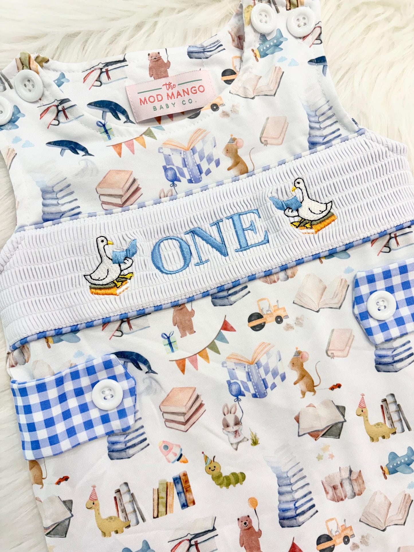 chapter one books birthday boy romper one for the books shortalls blue white gingham smash cake outfit overalls, ONE smocked romper first birthday books, storybooks baby goose embroidered smocked spring summer fall 1st birthday boy outfit romper baby boys reading 1st birthday, the mod mango baby co