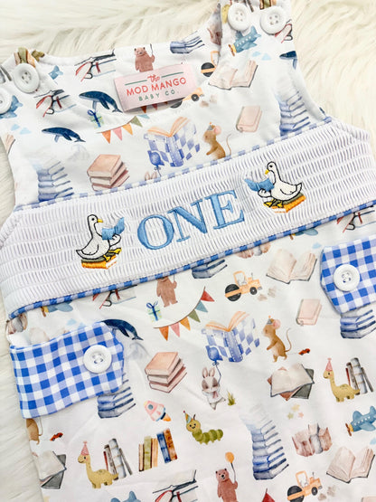 chapter one books birthday boy romper one for the books shortalls blue white gingham smash cake outfit overalls, ONE smocked romper first birthday books, storybooks baby goose embroidered smocked spring summer fall 1st birthday boy outfit romper baby boys reading 1st birthday, the mod mango baby co