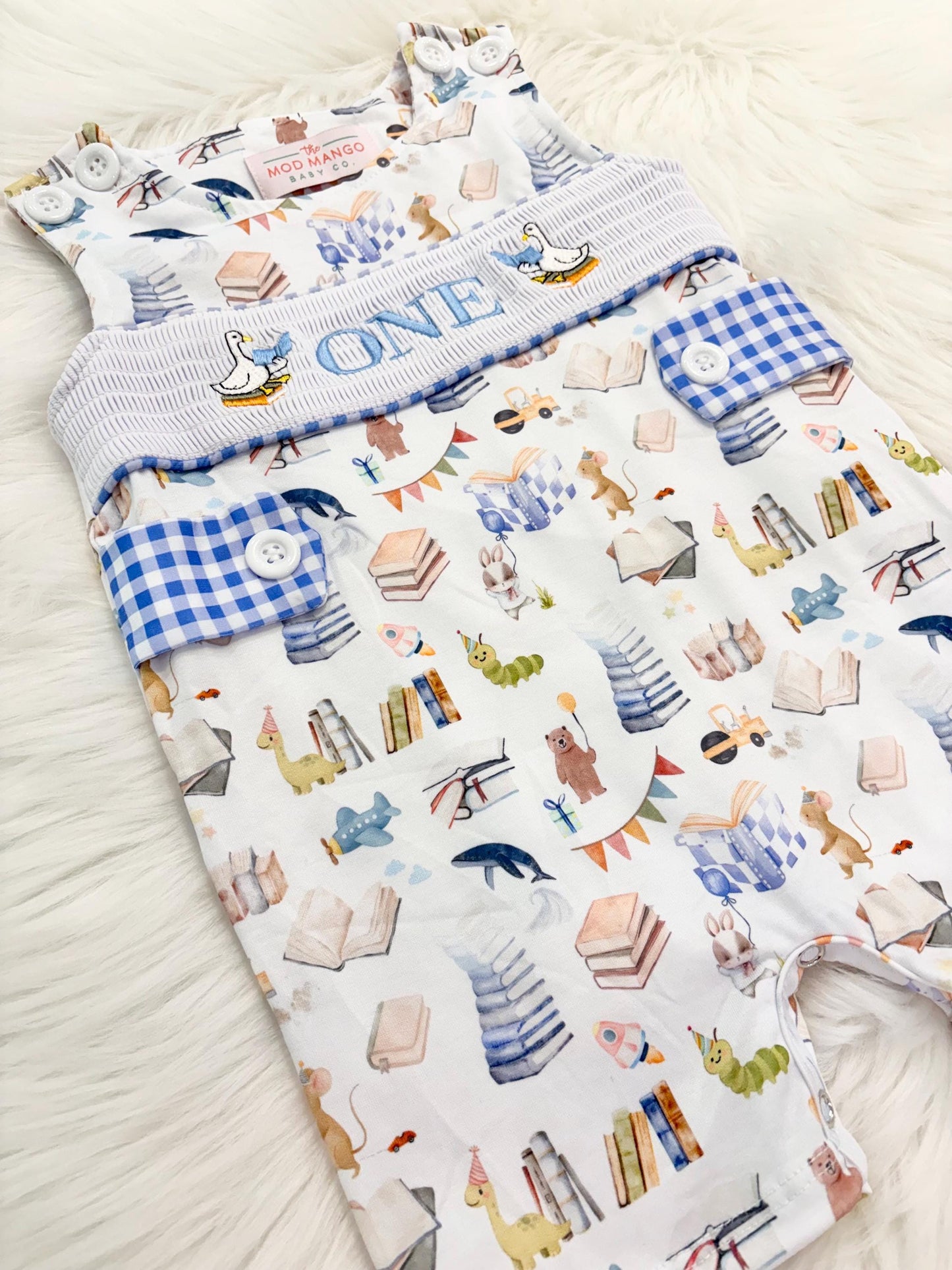 books birthday boy romper one for the books shortalls blue white gingham smash cake outfit overalls, ONE smocked romper first birthday books, storybooks baby goose embroidered smocked spring summer fall 1st birthday boy outfit romper baby boys reading 1st birthday, the mod mango baby co