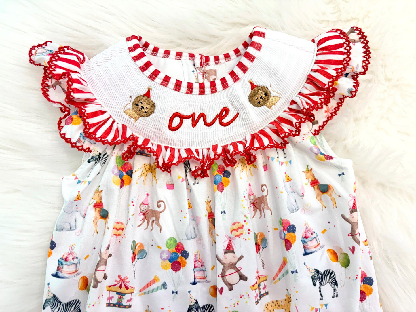 carnival circus party animal cake smash outfit first birthday girl romper 1st birthday red and white striped stripes colorful smash cake outfit bubble romper flutter sleeves, ONE smocked romper first birthday, animals lion embroidered smocked spring summer 1st birthday girl outfit romper baby girls cake smash outfit, the mod mango baby boutique co