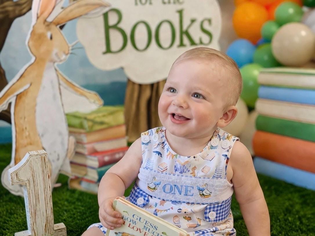 chapter one books birthday boy romper one for the books shortalls blue white gingham smash cake outfit overalls, ONE smocked romper first birthday books, storybooks baby goose embroidered smocked spring summer fall 1st birthday boy outfit romper baby boys reading 1st birthday, the mod mango baby co