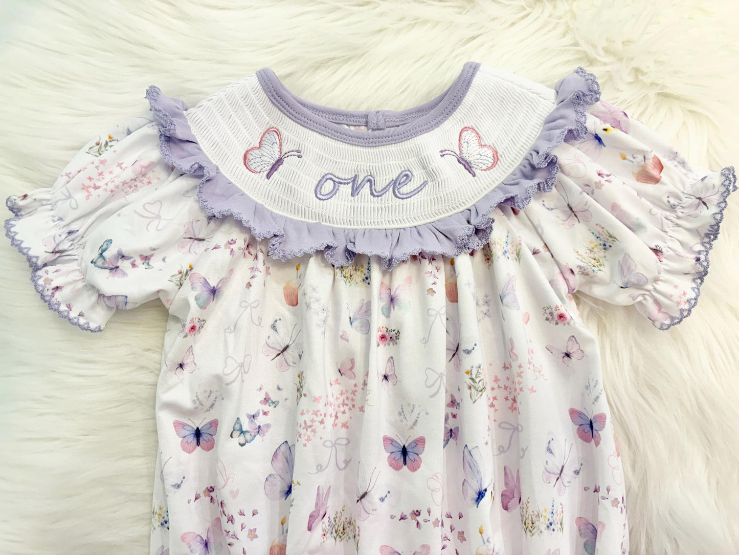 lavender purple butterfly flowers bows first birthday girl romper pink pastel floral and white outfit, pink lavender and white smocked bubble romper butterflies first birthday one year fluttered by ruffle bows embroidered smocked 1st birthday outfit romper baby girls, the mod mango, the mod mango baby co baby boutique
