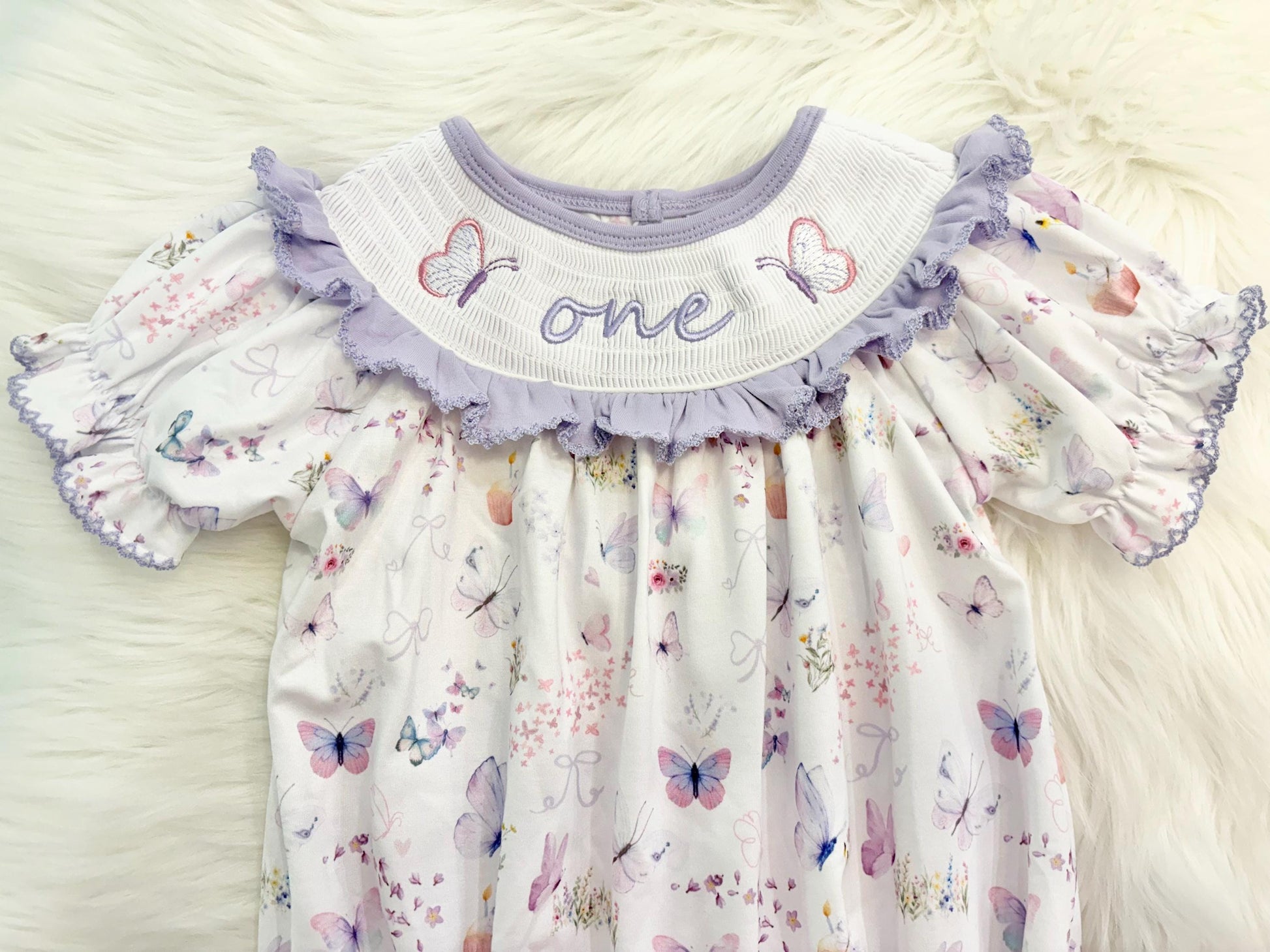 lavender purple butterfly flowers bows first birthday girl romper pink pastel floral and white outfit, pink lavender and white smocked bubble romper butterflies first birthday one year fluttered by ruffle bows embroidered smocked 1st birthday outfit romper baby girls, the mod mango, the mod mango baby co baby boutique
