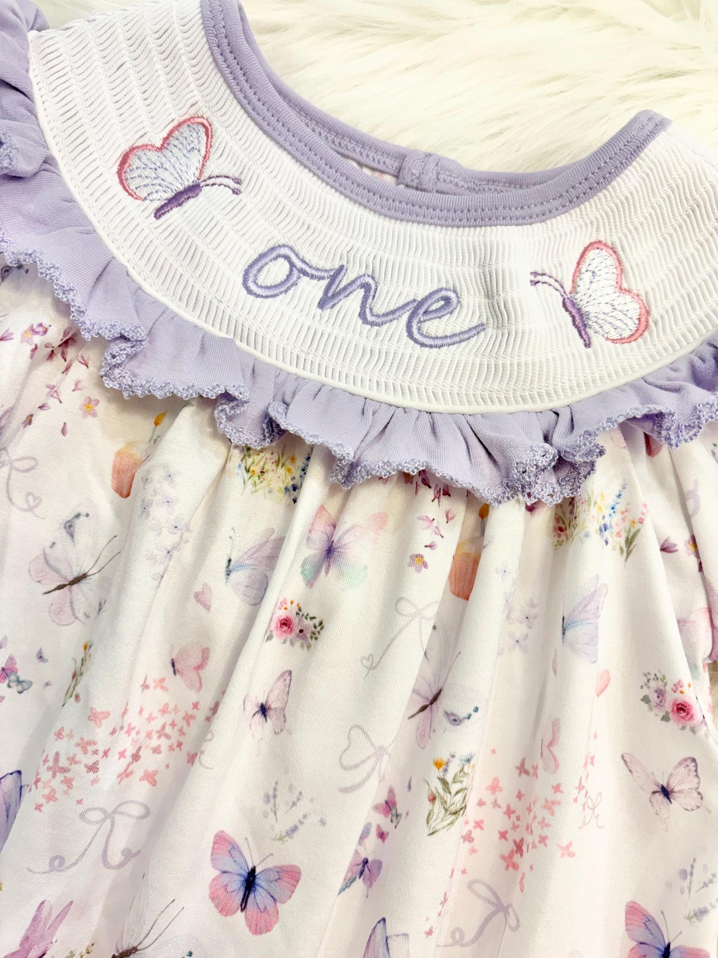 lavender purple butterfly flowers bows first birthday girl romper pink pastel floral and white outfit, pink lavender and white smocked bubble romper butterflies first birthday one year fluttered by ruffle bows embroidered smocked 1st birthday outfit romper baby girls, the mod mango, the mod mango baby co baby boutique