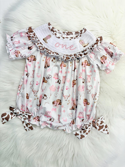 my first rodeo cowgirl girls first birthday bubble romper outfit pink bows brown cow print first birthday holy cow i'm one girl romper pink and white outfit, cowgirl boots pink smocked dress first birthday embroidered cow smocked short sleeve 1st birthday outfit ruffle dress baby girls, the mod mango