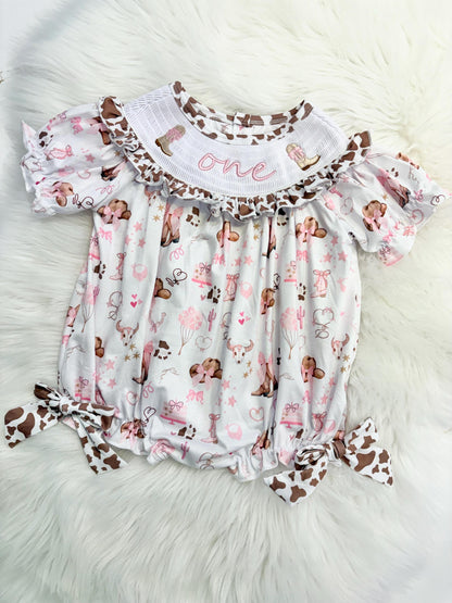 my first rodeo cowgirl girls first birthday bubble romper outfit pink bows brown cow print first birthday holy cow i'm one girl romper pink and white outfit, cowgirl boots pink smocked dress first birthday embroidered cow smocked short sleeve 1st birthday outfit ruffle dress baby girls, the mod mango