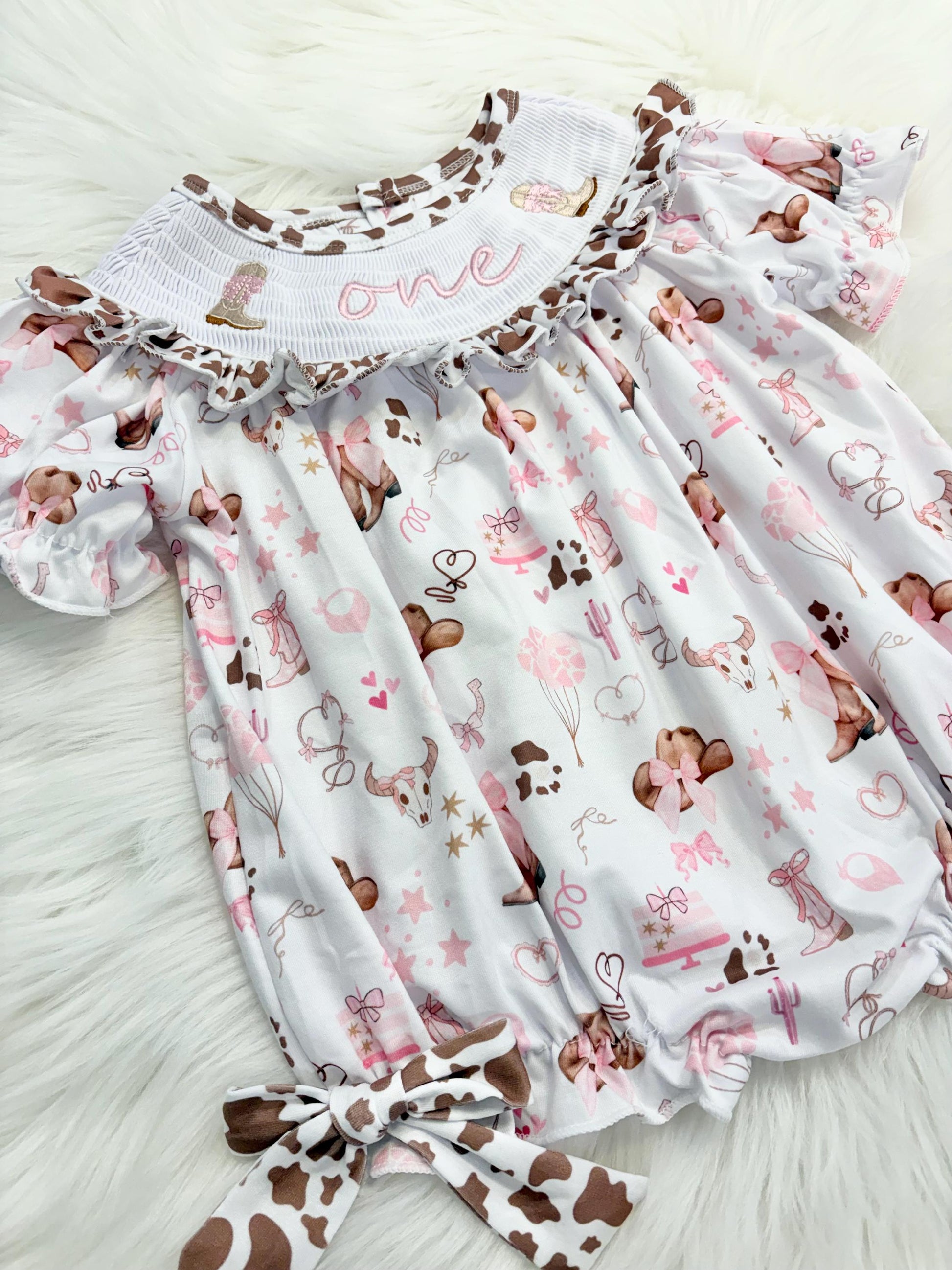 my first rodeo cowgirl girls first birthday bubble romper outfit pink bows brown cow print first birthday holy cow i'm one girl romper pink and white outfit, cowgirl boots pink smocked dress first birthday embroidered cow smocked short sleeve 1st birthday outfit ruffle dress baby girls, the mod mango