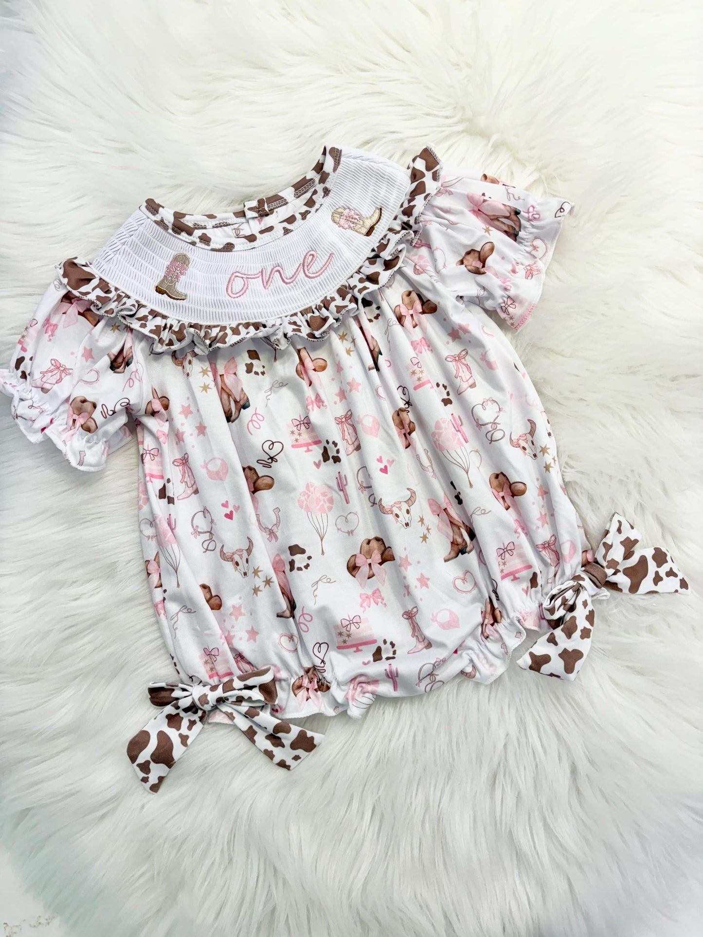 my first rodeo cowgirl girls first birthday bubble romper outfit pink bows brown cow print first birthday holy cow i'm one girl romper pink and white outfit, cowgirl boots pink smocked dress first birthday embroidered cow smocked short sleeve 1st birthday outfit ruffle dress baby girls, the mod mango