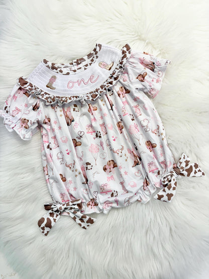 my first rodeo cowgirl girls first birthday bubble romper outfit pink bows brown cow print first birthday holy cow i'm one girl romper pink and white outfit, cowgirl boots pink smocked dress first birthday embroidered cow smocked short sleeve 1st birthday outfit ruffle dress baby girls, the mod mango