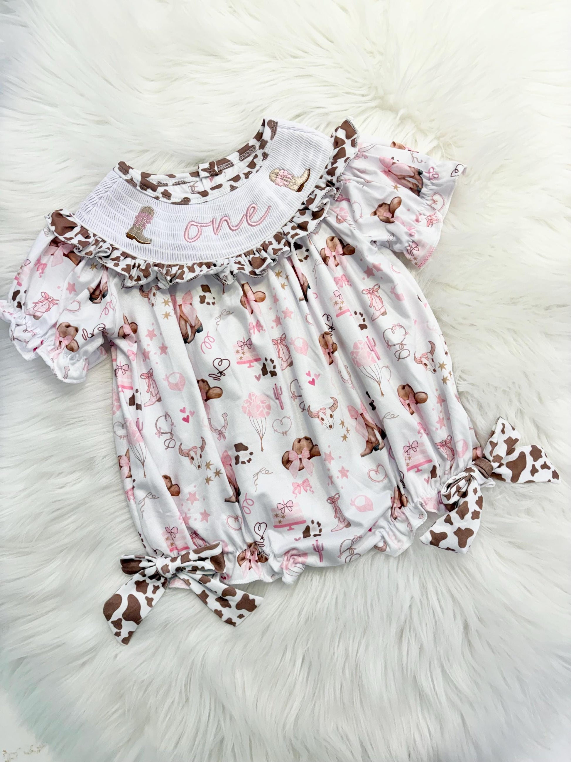 my first rodeo cowgirl girls first birthday bubble romper outfit pink bows brown cow print first birthday holy cow i'm one girl romper pink and white outfit, cowgirl boots pink smocked dress first birthday embroidered cow smocked short sleeve 1st birthday outfit ruffle dress baby girls, the mod mango
