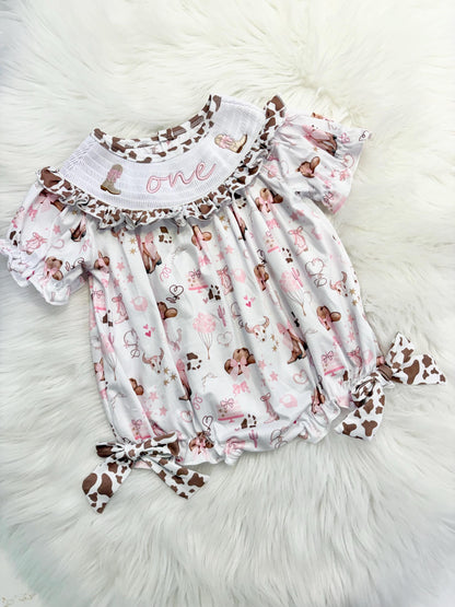 my first rodeo cowgirl girls first birthday bubble romper outfit pink bows brown cow print first birthday holy cow i'm one girl romper pink and white outfit, cowgirl boots pink smocked dress first birthday embroidered cow smocked short sleeve 1st birthday outfit ruffle dress baby girls, the mod mango