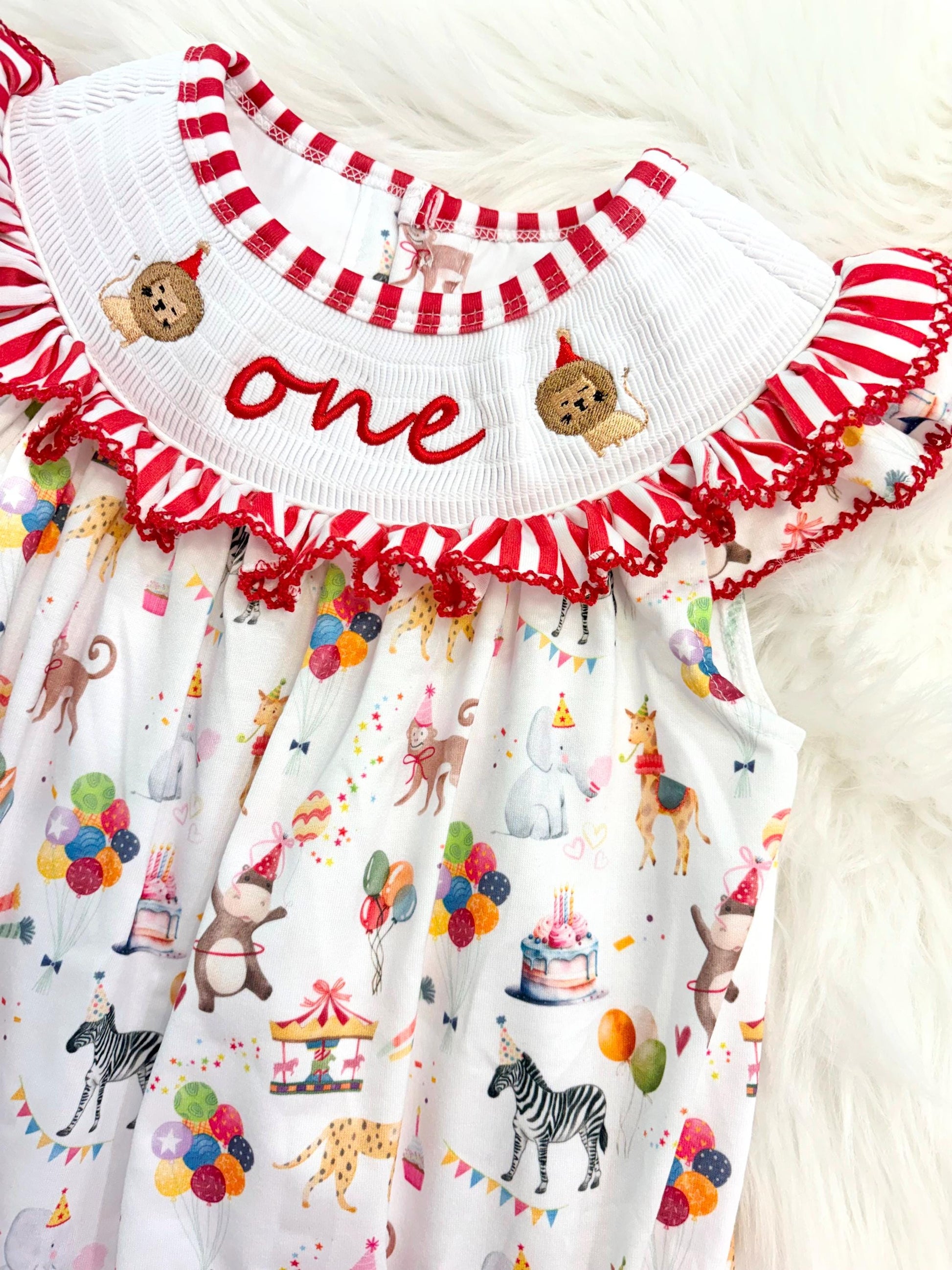 carnival circus party animal cake smash outfit first birthday girl romper 1st birthday red and white striped stripes colorful smash cake outfit bubble romper flutter sleeves, ONE smocked romper first birthday, animals lion embroidered smocked spring summer 1st birthday girl outfit romper baby girls cake smash outfit, the mod mango baby boutique co