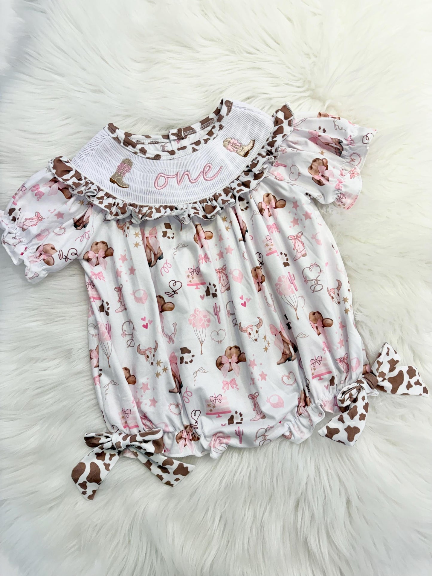 my first rodeo cowgirl girls first birthday bubble romper outfit pink bows brown cow print first birthday holy cow i'm one girl romper pink and white outfit, cowgirl boots pink smocked dress first birthday embroidered cow smocked short sleeve 1st birthday outfit ruffle dress baby girls, the mod mango