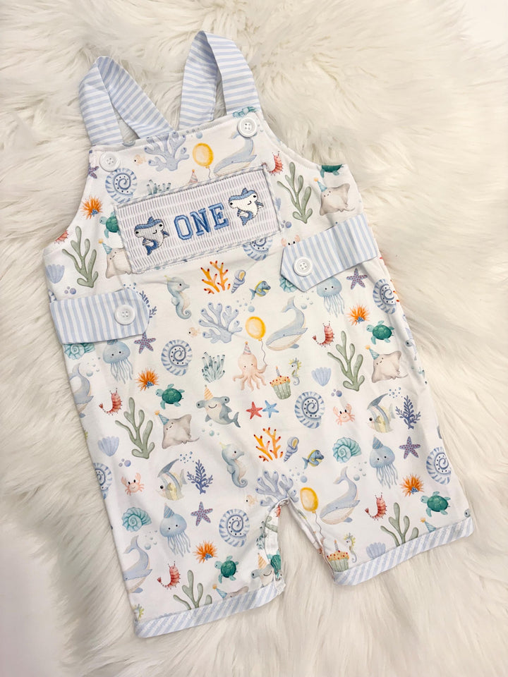 oneder the sea cake smash outfit first birthday boy romper under the sea ocean summer baby blue green white orange blue smash cake outfit overalls, ONE smocked romper first birthday sea ocean creatures party fish, beach ocean shark whale seashells octopus outdoors embroidered smocked spring summer 1st birthday boy outfit romper baby boys cake smash outfit, the mod mango baby boutique co