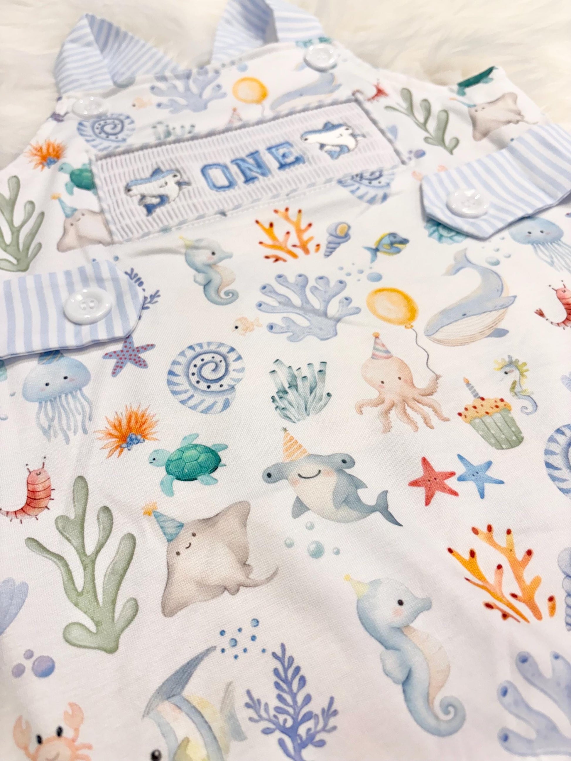 oneder the sea cake smash outfit first birthday boy romper under the sea ocean summer baby blue green white orange blue smash cake outfit overalls, ONE smocked romper first birthday sea ocean creatures party fish, beach ocean shark whale seashells octopus outdoors embroidered smocked spring summer 1st birthday boy outfit romper baby boys cake smash outfit, the mod mango baby boutique co