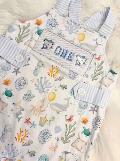 oneder the sea cake smash outfit first birthday boy romper under the sea ocean summer baby blue green white orange blue smash cake outfit overalls, ONE smocked romper first birthday sea ocean creatures party fish, beach ocean shark whale seashells octopus outdoors embroidered smocked spring summer 1st birthday boy outfit romper baby boys cake smash outfit, the mod mango baby boutique co