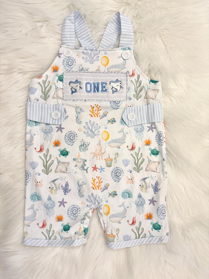 oneder the sea cake smash outfit first birthday boy romper under the sea ocean summer baby blue green white orange blue smash cake outfit overalls, ONE smocked romper first birthday sea ocean creatures party fish, beach ocean shark whale seashells octopus outdoors embroidered smocked spring summer 1st birthday boy outfit romper baby boys cake smash outfit, the mod mango baby boutique co