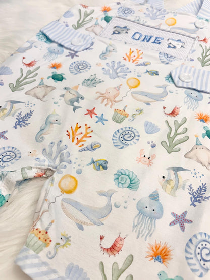 oneder the sea cake smash outfit first birthday boy romper under the sea ocean summer baby blue green white orange blue smash cake outfit overalls, ONE smocked romper first birthday sea ocean creatures party fish, beach ocean shark whale seashells octopus outdoors embroidered smocked spring summer 1st birthday boy outfit romper baby boys cake smash outfit, the mod mango baby boutique co