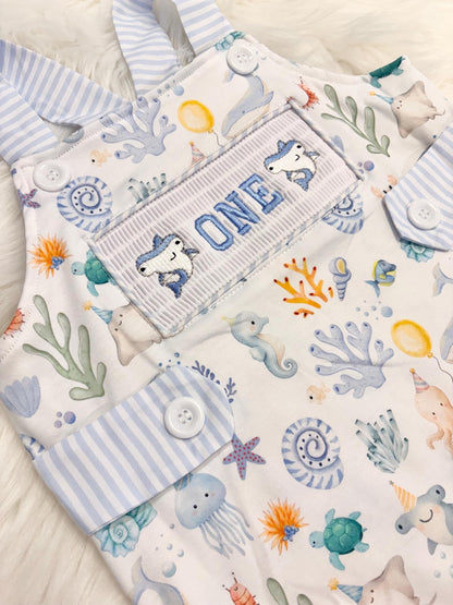 oneder the sea cake smash outfit first birthday boy romper under the sea ocean summer baby blue green white orange blue smash cake outfit overalls, ONE smocked romper first birthday sea ocean creatures party fish, beach ocean shark whale seashells octopus outdoors embroidered smocked spring summer 1st birthday boy outfit romper baby boys cake smash outfit, the mod mango baby boutique co