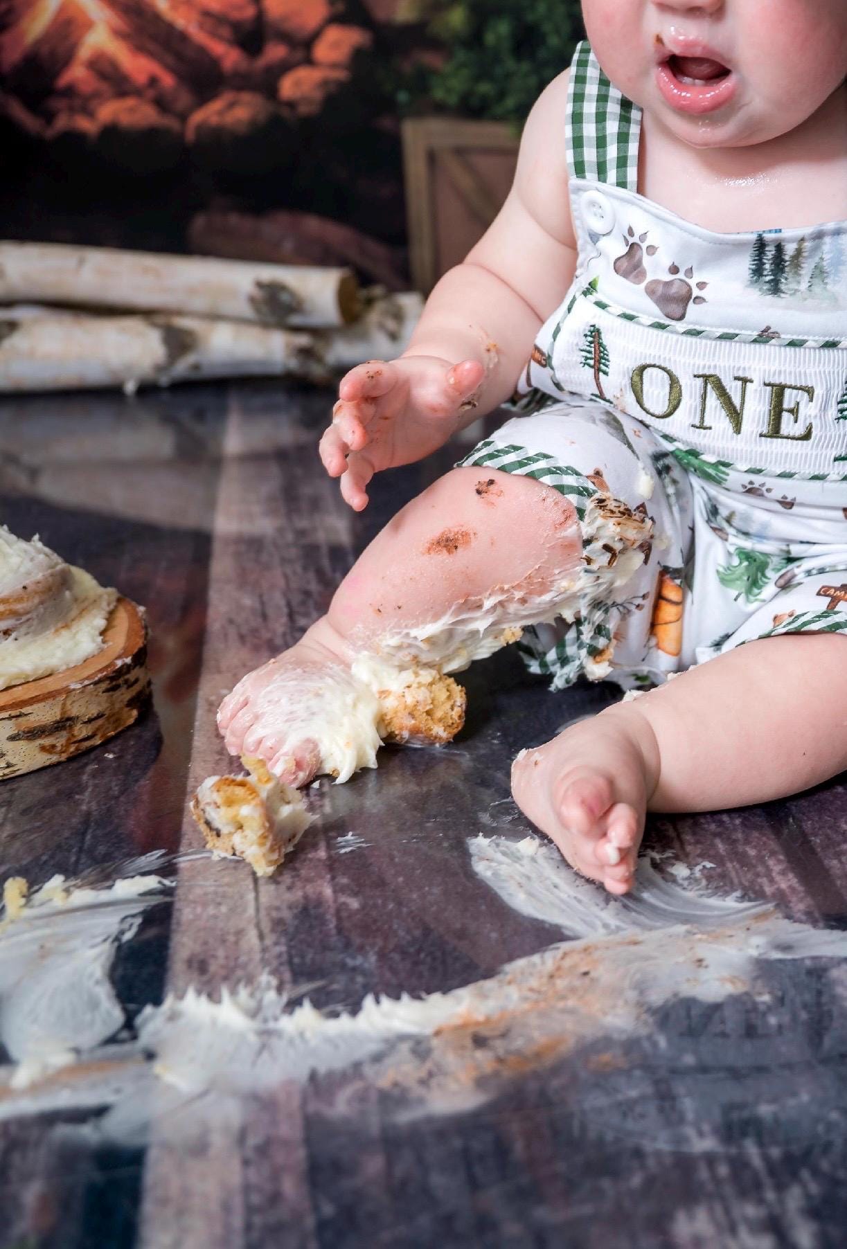 one happy camper cake smash outfit first birthday boy romper camping hunter green white gingham tan beige brown smash cake outfit overalls, ONE smocked romper first birthday camping, outdoors embroidered smocked spring summer 1st birthday boy outfit romper baby boys cake smash outfit, the mod mango baby boutique co