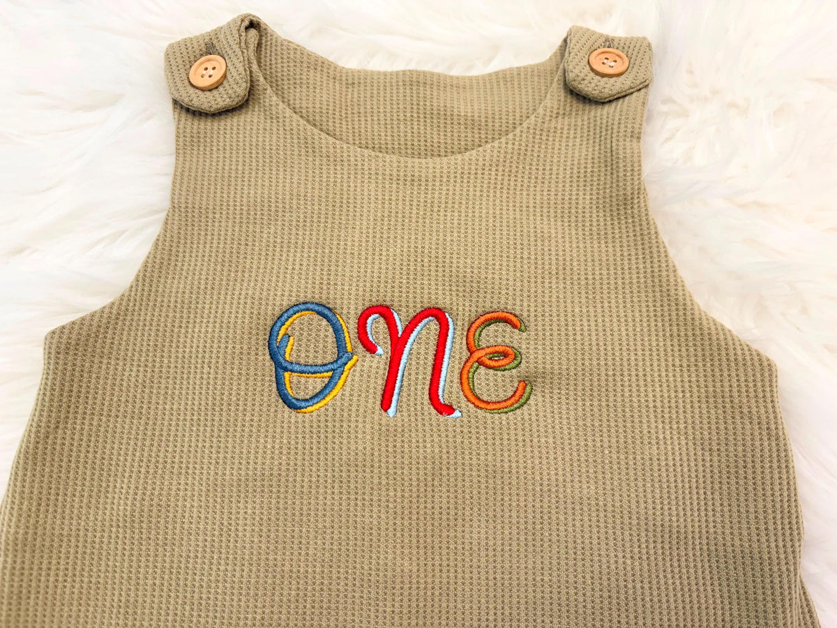 colorful green fun to be one waffle knit baby boys first birthday one romper overalls jon jons olive green, blue, yellow, red, orange, first birthday theme boys romper first birthday overalls outfit one boys first birthday outfit, the mod mango baby boutique co