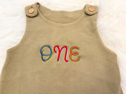 colorful green fun to be one waffle knit baby boys first birthday one romper overalls jon jons olive green, blue, yellow, red, orange, first birthday theme boys romper first birthday overalls outfit one boys first birthday outfit, the mod mango baby boutique co
